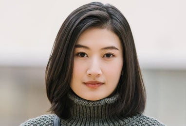 Woman smiling at camera.